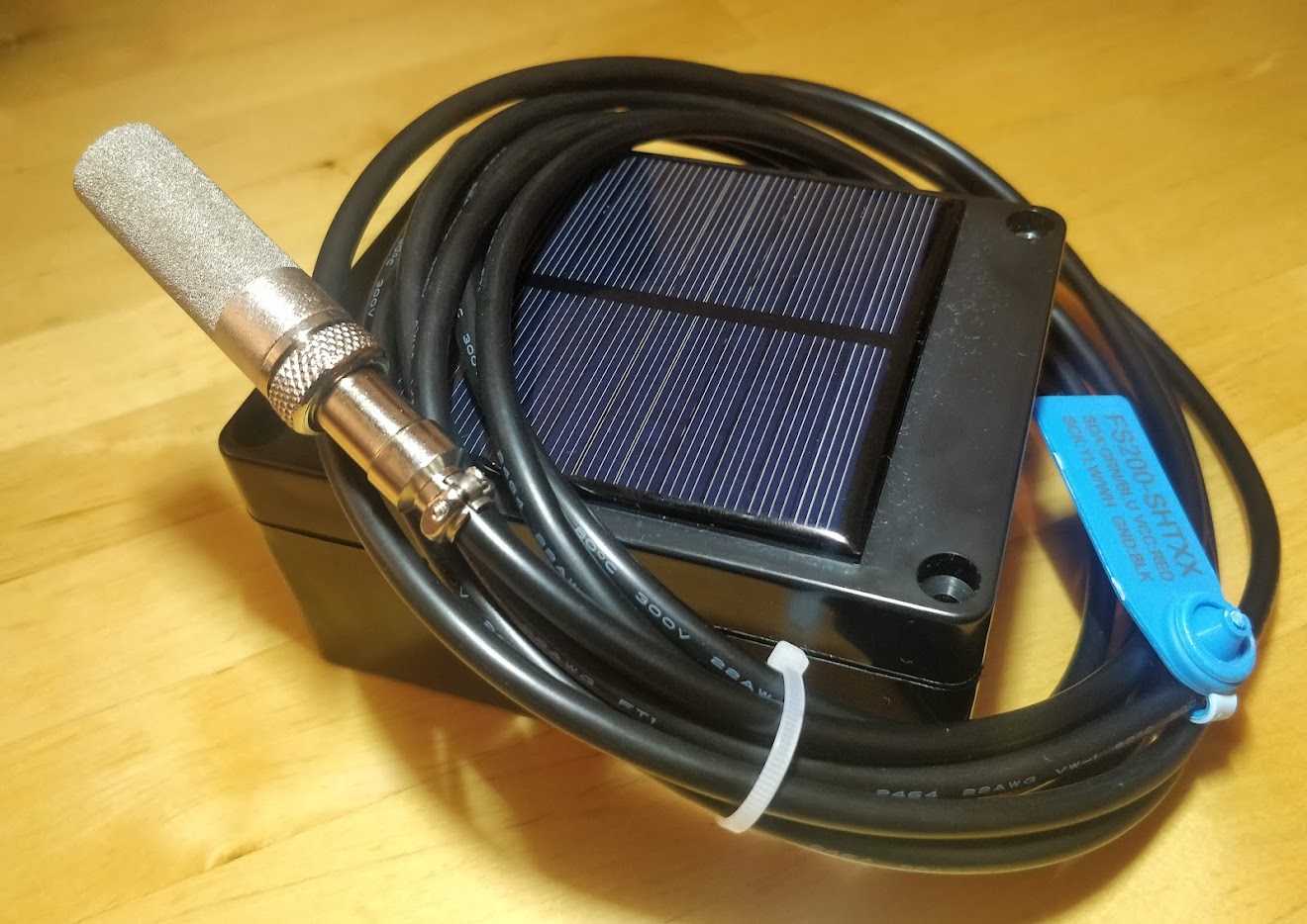Custom solar-powered sensor with an SHT temperature and humidity probe in a sintered filter cap