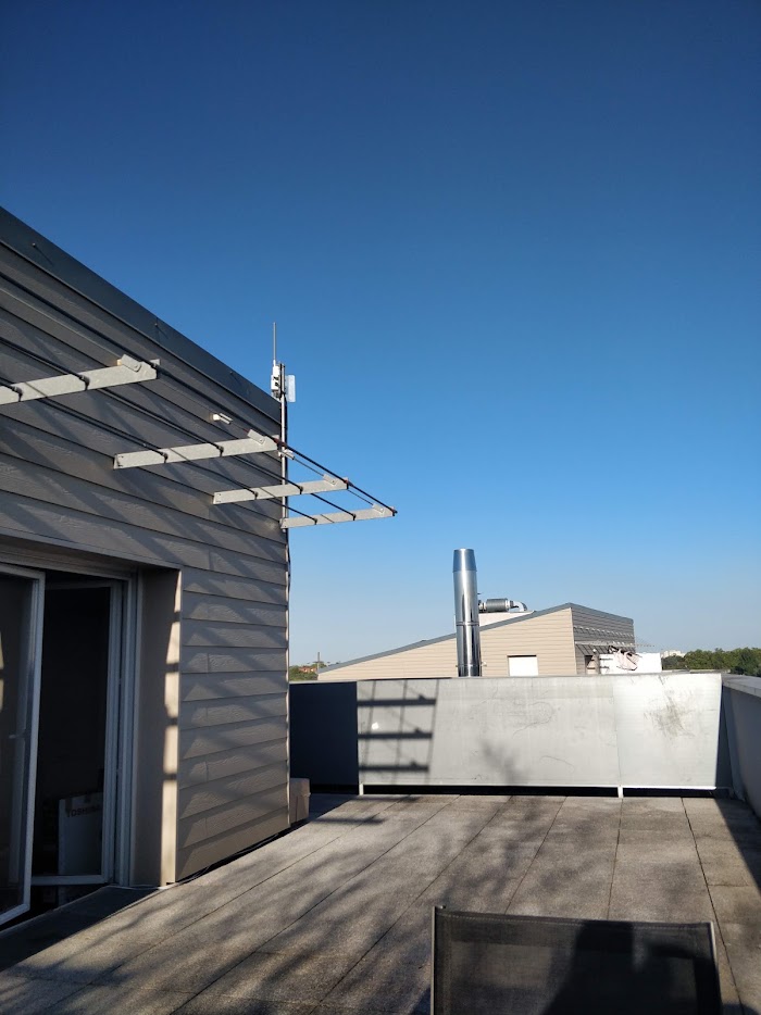 A gateway and antenna installed on a rooftop, where the cost is access and time rather than hardware