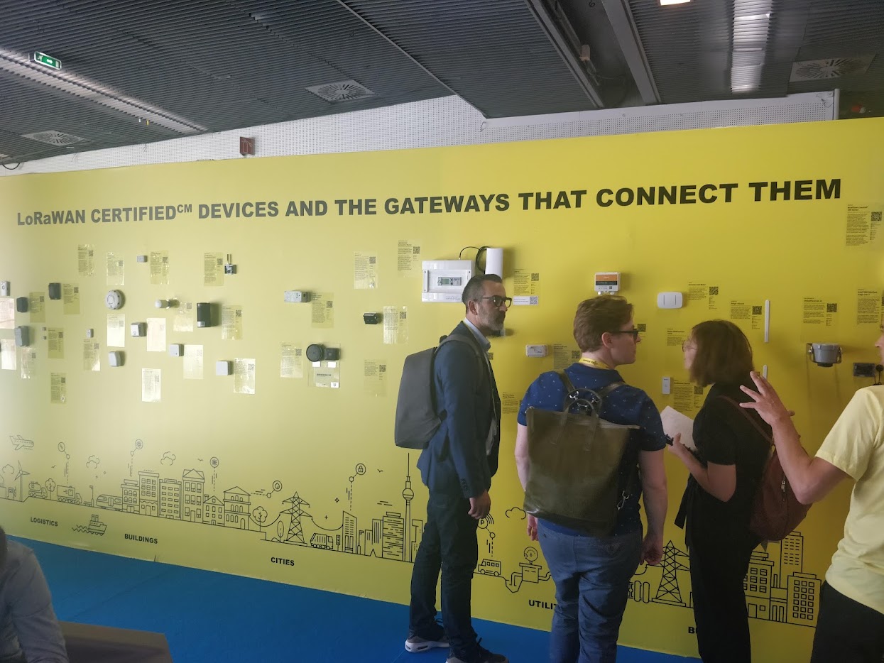 A wall of certified IoT devices at a trade show, where every price on display is only the first cost